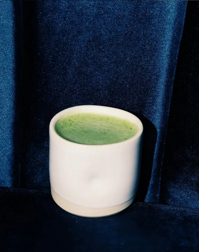 Ceramic cup of matcha on velvet