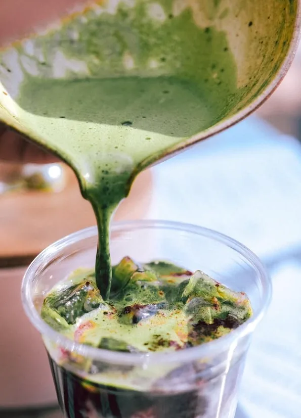 Matcha being poured over ice